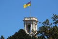 The flag of the Governor of Victoria raised over the belvedere tower of Government House, Melbourne.