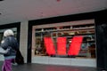 MELBOURNE, AUSTRALIA - JULY 26, 2018: Aged woman walks in front of Westpac bank in Melbourne Australia