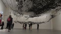 Contemporary art installation of starling flock swarms overhead