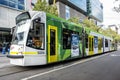 Classic city tram traveling along Swanston Street