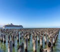 Melbourne, Australia - November 26, 2018: Cruise ship Carnival Legend docked next to old wooden pylons of historic Princes Pier in Royalty Free Stock Photo