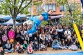 Aerial acrobat during live street performance.