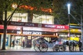 Melbourne, Australia - October 17,2013 : white horse drawn carriage in front of burger shop