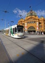 Melbourne public transport tram passing the historic Flinders Street station