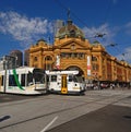 Melbourne public transport trams passing the historic Flinders Street station