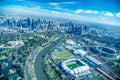 MELBOURNE - SEPTEMBER 8, 2018: Aerial view of city skyline and stadiums from helicopter. Melbourne attracts 15 million people Royalty Free Stock Photo