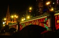 Princes Bridge with red green and yellow lighting in the night Royalty Free Stock Photo