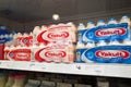 Some bottles of Yakult probiotic milk on the supermarket shelf. It`s a sweetened  beverage fermented with the lactobacillus paraca Royalty Free Stock Photo