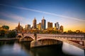 Sunset over skyline of Melbourne downtown, Princess Bridge and Yarra River