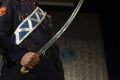 Melee weapon in hand. Cossack holding saber. Sword Blade