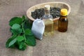 Melissa herb using, tea bag, dry lemon balm, melissa oil and bottle with essence