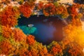 Melissani Cave with autumn colors. Famous Melissani lake on Kefalonia island, Karavomylos, Greece. On top of Melissani Cave (