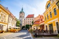 Melnik, Czech Republic - 29.07.2020: City landscape, an old city street at sunset with numerous cafes and the high clock tower of