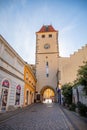 Melnik, Czech Republic - 29.07.2020: City landscape, an old city street at sunset with numerous cafes and the high clock tower,