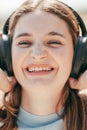 Melodic Bliss: Close-Up Portrait of a Beautiful Brunette Lost in Musical Delight, close up portrait of a beautiful cute Royalty Free Stock Photo