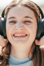 Melodic Bliss: Close-Up Portrait of a Beautiful Brunette Lost in Musical Delight, close up portrait of a beautiful cute