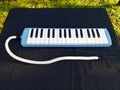 Melodica keyboard instrument on black background, music tool for learning, education and performance. Royalty Free Stock Photo