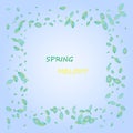 Melody of spring, green leaves frame on a blue background. A fresh design idea with a bright element to draw attention