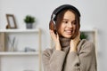 woman young caucasian lady music student happy earphones home headphones indoor Royalty Free Stock Photo