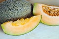 Melon or cantaloupe sliced on wooden board with seeds (Also call