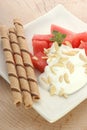 Melon with cream fresh and almond slivers