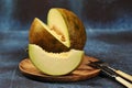 Melon cut in half and into pieces Royalty Free Stock Photo