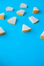 Melon cut into small pieces on a blue background, fresh fruit for snacks, Royalty Free Stock Photo