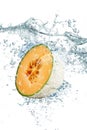 Melon falling in water Royalty Free Stock Photo