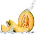 Melon falling in water Royalty Free Stock Photo