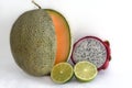 Melon fruit with Pitaya or dragon fruit and lime on white background Royalty Free Stock Photo