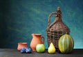 Melon, pear, apple, plum and ceramic dishes