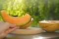 Melon.piece of ripe melon.Melon in a cut in female hands. Appetizing summer fruits. Women& x27;s hands cut a melon Royalty Free Stock Photo