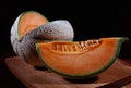 Melon and slice of juicy melon on a wooden board Royalty Free Stock Photo