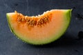 Melon slice on rock plate Royalty Free Stock Photo