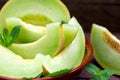 Melon slice in rustic bowl, slices of cantaloupe close-up Royalty Free Stock Photo