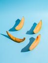 Sliced pieces of melon on blue background Royalty Free Stock Photo