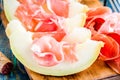 Melon with thin slices of prosciutto