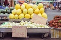 Melons on stalls with price tags at a street market in Cho Lon, Ho Chi Minh City, Vietnam