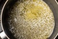 Melt the butter in a saucepan. The initial stage of preparing the sauce Royalty Free Stock Photo
