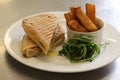 A melted cheese and herb panini with chunky chips Royalty Free Stock Photo