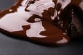 Melted chocolate dripping in pieces, sweet dessert Royalty Free Stock Photo