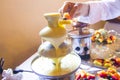 Melted chocolate fountain that descends sweet and soft Royalty Free Stock Photo