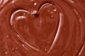 Melted chocolate heart background. The texture of liquid dark chocolate Royalty Free Stock Photo