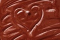 Melted chocolate heart background. The texture of liquid dark chocolate Royalty Free Stock Photo