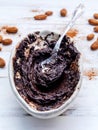 Melted chocolate with metal spoon in ceramic bowl and roast coco Royalty Free Stock Photo