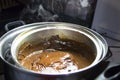 Melted chocolate in pan under a water bath. Making hot chocolate at home in your own kitchen Royalty Free Stock Photo