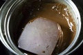 Melted chocolate in pan under a water bath. Making hot chocolate at home in your own kitchen Royalty Free Stock Photo