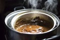 Melted chocolate in pan under a water bath. Making hot chocolate at home in your own kitchen Royalty Free Stock Photo