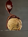 Melted chocolate pouring on caramel ice cream Royalty Free Stock Photo