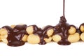 Melted Chocolate Pouring Over Peanuts Royalty Free Stock Photo